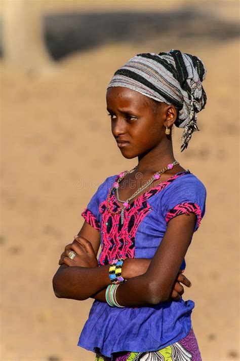 Unidentified Fulani Girl In Colored Clothes And Headscarf Looks
