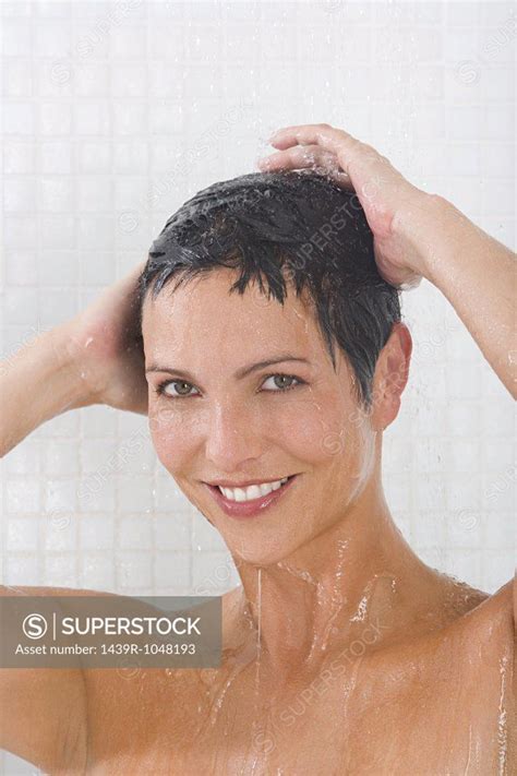 woman showering superstock