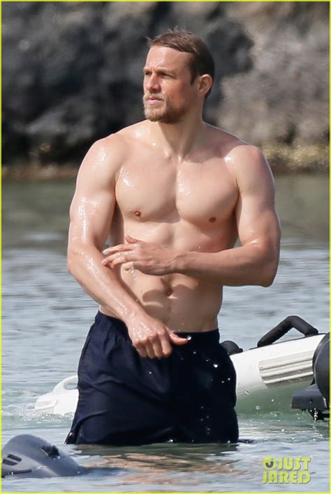 Shirtless Charlie Hunnam Puts On Sunscreen At The Beach In These Hot New Photos Photo