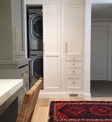 A curtain can hide a washing machine if it doesn't fully fit a kitchen cabinet. Cabinet To Hide Stackable Washer And Dryer | Cabinets Matttroy
