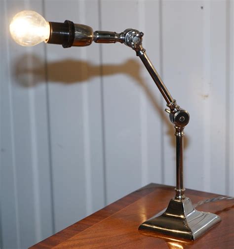 Pair Of Small Solid Polished Metal Table Lamps With Two Points Of