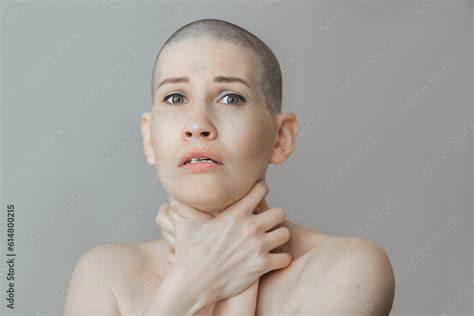 Portrait Of An Emotional Young Beautiful Woman With A Shaved Head She