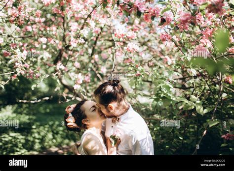 Middle Eastern Couple Kissing Under Flowering Tree Stock Photo Alamy