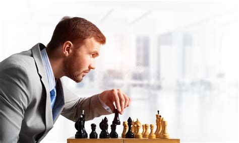Concentrated Businessman Playing Chess Game Stock Photo Image Of