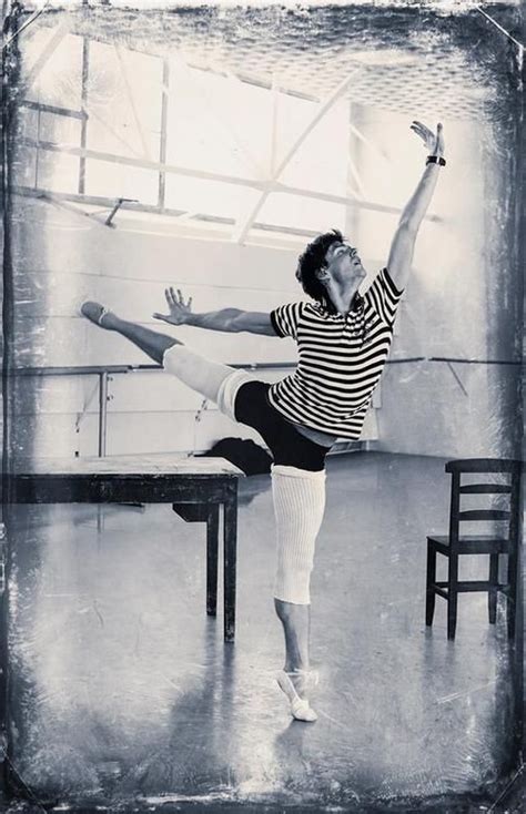 A Black And White Photo Of A Ballerina Doing An Acrobatic Move