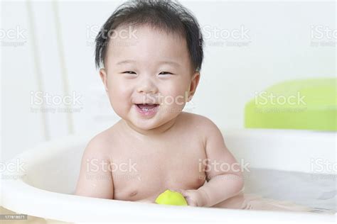 Baby In Bath Stock Photo Download Image Now Baby Bathtub One