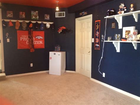 The Room Is Decorated With Sports Memorabilia And Football Decorations