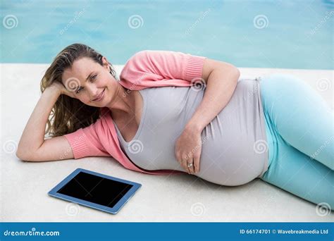 Pregnant Woman Relaxing Outside Using Tablet Stock Image Image Of Digital Pool 66174701