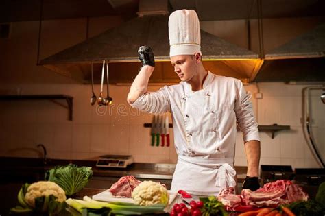 Professional Chef Cook Meal In The Kitchen Of Restaurant Chief Chef