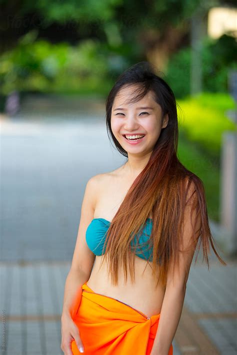Pretty Young Asian Or Chinese Woman Wearing Bikini In The Garden By Bo Bo