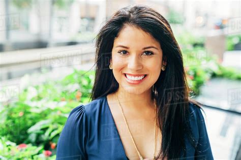 Close Up Portrait Of Smiling Hispanic Woman Stock Photo Dissolve