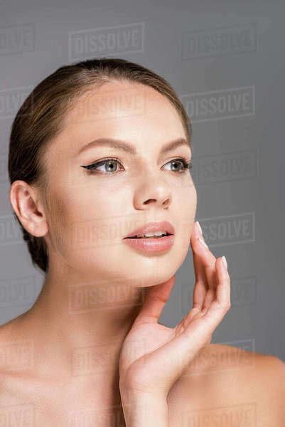 Portrait Of Beautiful Woman With Nude Makeup Isolated On Grey Stock Photo Dissolve
