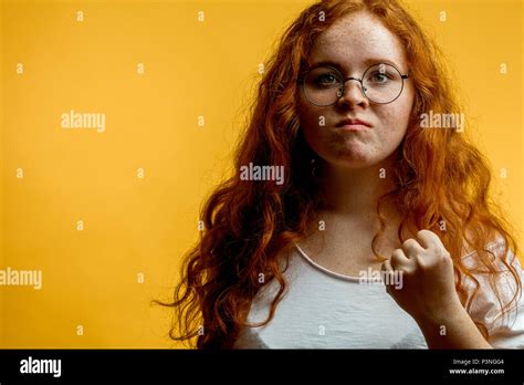 Young Pretty Ginger Woman Shows Fist With Angry Or Aggressive