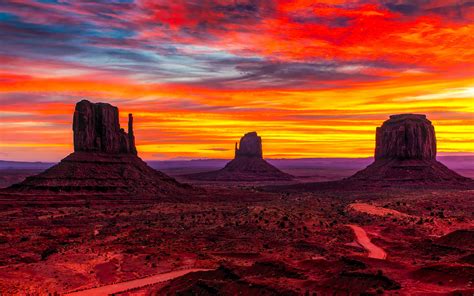 Sunset Monument Valley Desert Region Of Red Sand Arizona