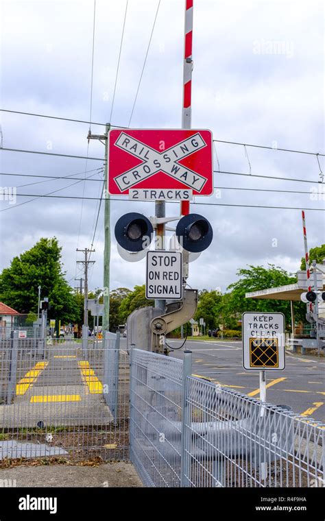 Australian Railway Crossing Red With White Cross Waning Sign On Road