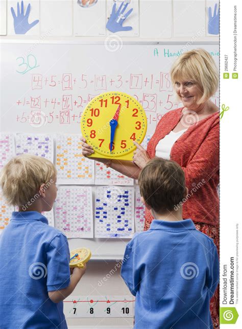 Teacher Teaching Kids To Tell Time Stock Image Image Of
