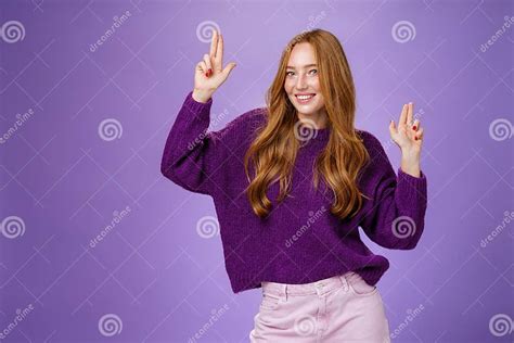 Girl In Happy And Energized Mood Dancing Having Fun Making Finger Pistols Gesture As Smiling