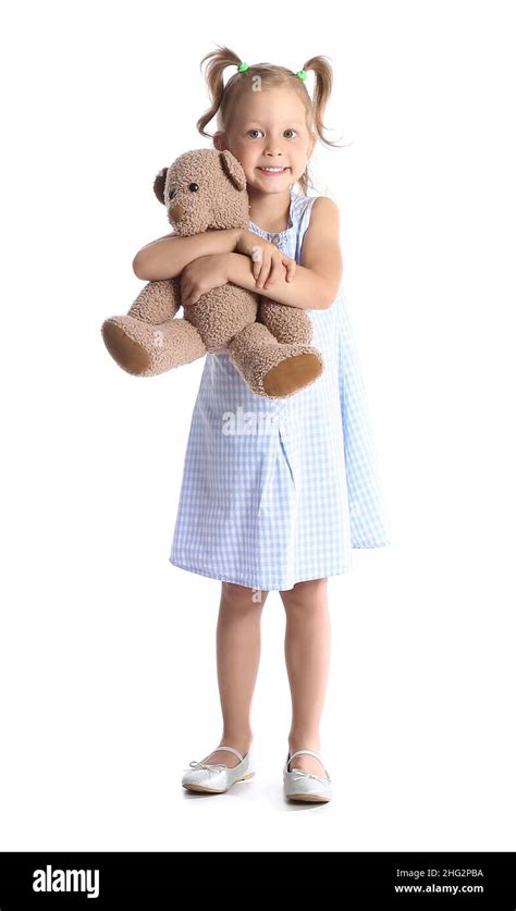 Adorable Little Girl Holding Teddy Bear On White Background Stock Photo