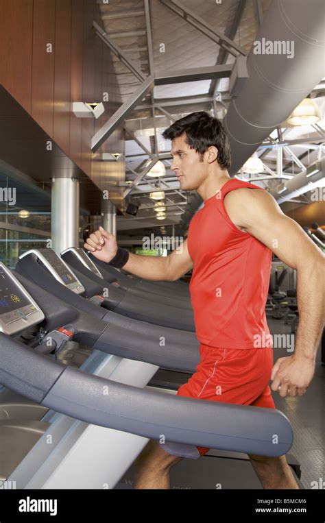 A Man Exercising On A Treadmill Stock Photo Alamy