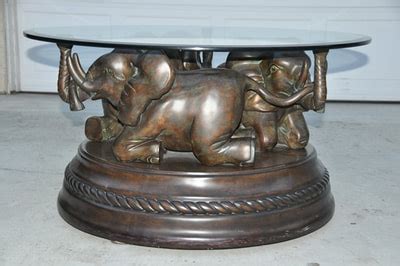 Sometimes you may want to relax the feet on there, at times it provides as a color section, and other times it suffices as a work corner. Bombay Company glass top coffee table with 3 elephant ...