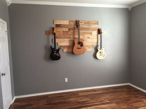 Guitar hangers hook holder wood rubber instrument hangers wall stand for guitars bass ukulele string instrument accessories. DIY pallet wood hanging guitar display. Weekend project ...