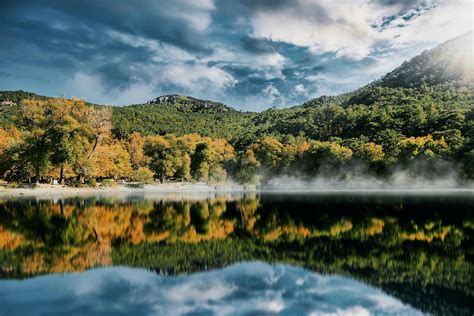 Green Trees Near Lake Under White Clouds And Blue Sky · Free Stock Photo