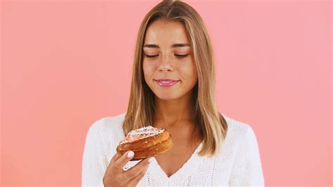 Female Is Holding Bun Sprinkled With Icing Stock Footage Sbv 338898469 Storyblocks