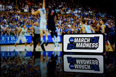 March Madness Logo On Screen And Ncaa Basketball Game Play On Tv In The