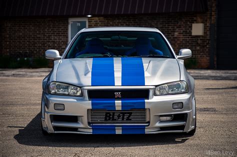 Front Of Silver R34 Nissan Skyline Gt R With Blue Stripes
