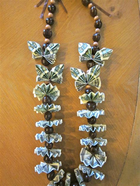 Take the time to align all the edges and hold them in place carefully while you crease. Graduation money Lei with genuine Kukui nut lei | Money ...