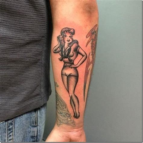 A Pin Ups Tattoos Filled With Perspective And Elegance On The Arm