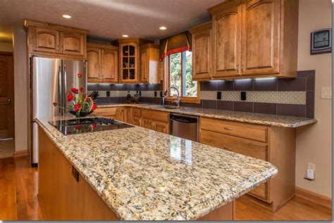 Choose flooring that matches the maple colors or contrasts with them, depending with their golden color, light maple cabinets can instantly warm and brighten any kitchen. Giallo Ornamental Granite With Maple Cabinets | online ...