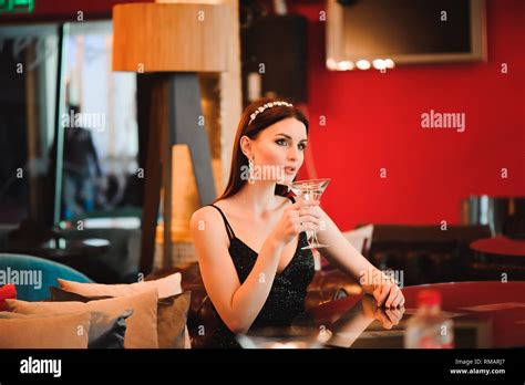 Portrait Of Beautiful Woman Holding Glass Of Martini Stock Photo Alamy