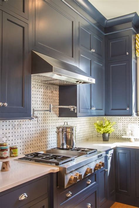 Most of us think we know how to clean kitchen cabinets, but a closer look might tell a different story — and it could be a dirty one. HGTV Smart Home | White kitchen backsplash, Diy kitchen ...