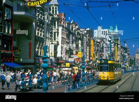 1999 Historical Street Scene Tram Damrak Amsterdam Holland Stock Photo