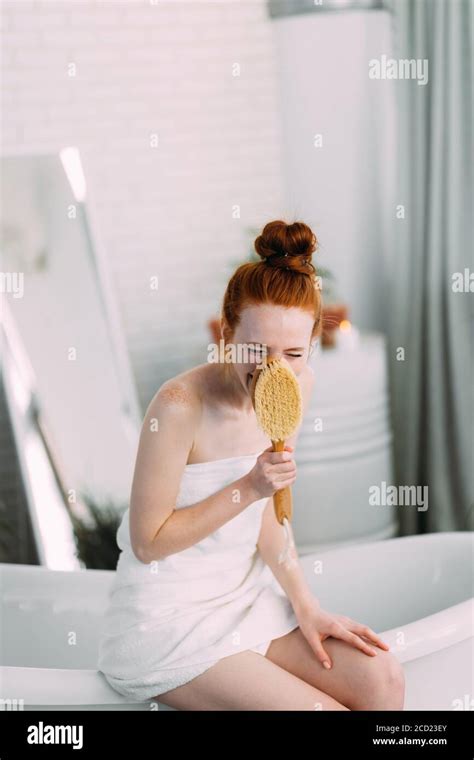 Joyful Beautiful Caucasian Woman With Redhead Hair Knot Wrapped In Bath