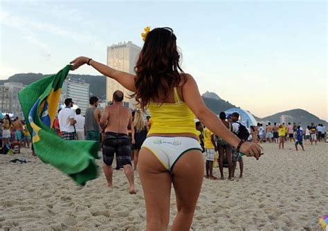 a brazilian girl waves a flag at the fan fest in copacabana beach in rio de janeiro brazil on