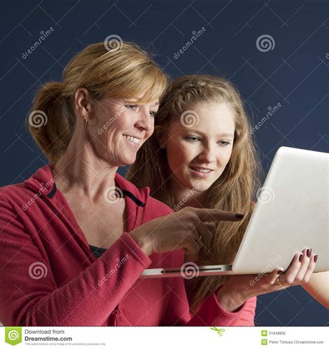 Couple Looking At A Laptop Computer Stock Photo Image Of Device Women