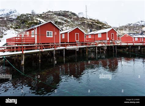 The Traditional Red Cabins In Nusfjord Fishing Village In The Lofoten