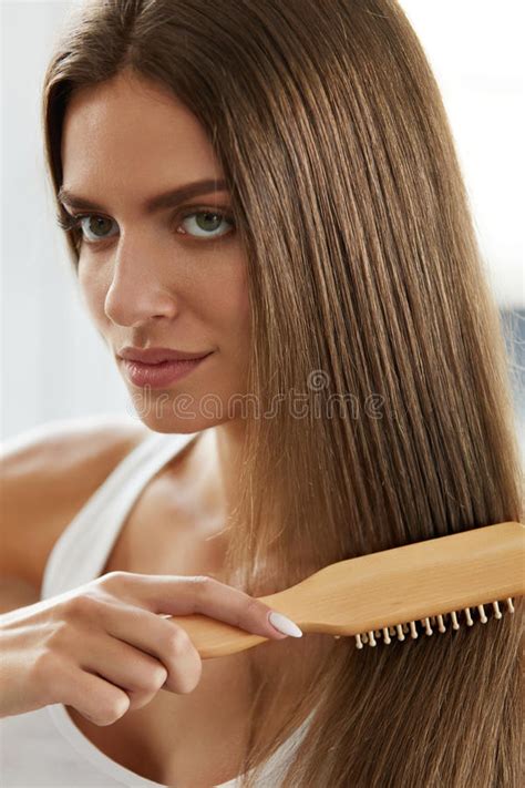 Woman Brushing Beautiful Healthy Long Hair With Brush Portrait Stock