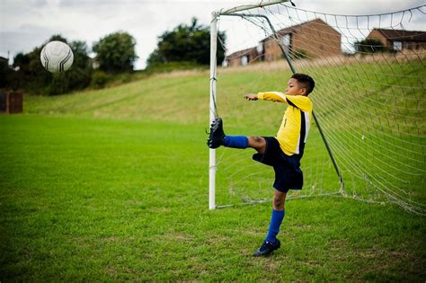 Junior Football Goalie In Action Free Photo Rawpixel