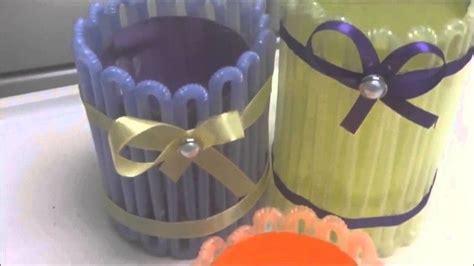 Three Different Colored Vases With Ribbons On Them