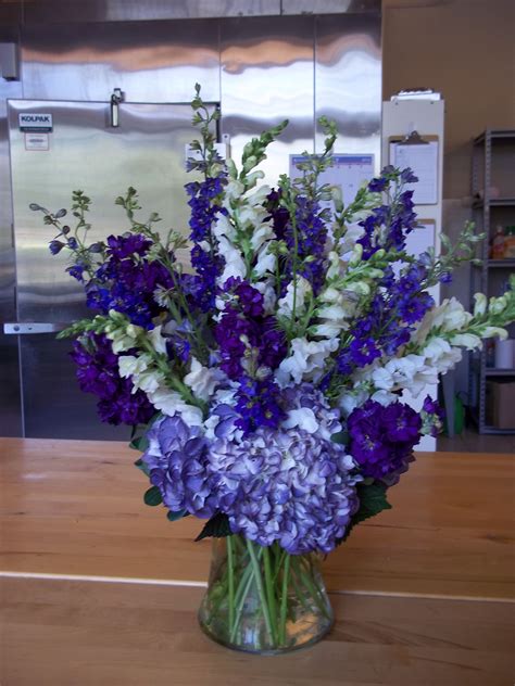 purple hydrangeas along with purple larkspur stock and white snap dragpns make for a … flower