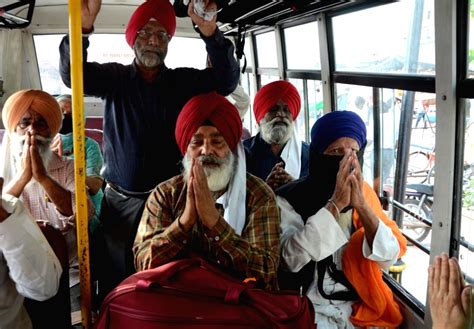 Sikh Pilgrims Wave From A Bus Before Leaving For Pakistan For Baisakhi