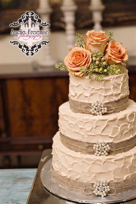 Three Tiered Rustic Wedding Cake Wrapped In Burlap With Pearl Broaches