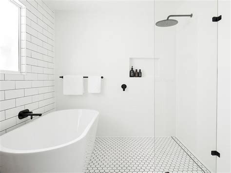 This bathroom takes it a step further by continuing a black and white striped tile pattern from the walls into the shower. Bath and shower in narrow bathroom | Bathroom style ...