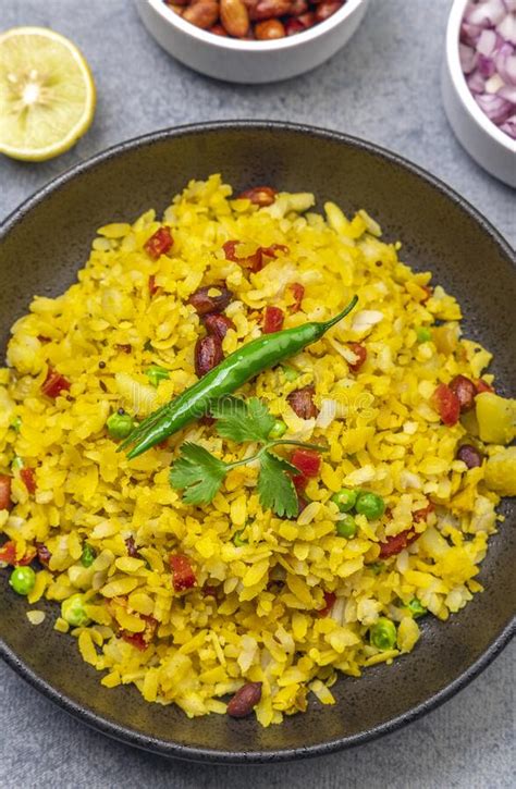 Spicy Indian Snack Or Breakfast Poha With Onion And Peanuts Stock Image