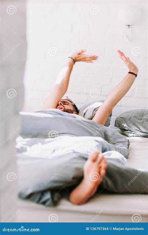 Young Man Waking Up In The Bed Stock Photo Image Of Awake Home