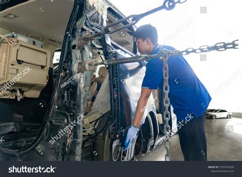Auto Repairman Worker Automotive Industry Examining Stock Photo