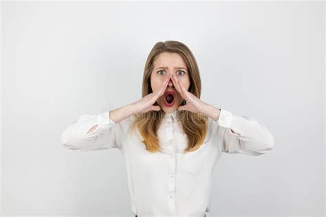 Young Beatuiful Blond Woman Shouting Loud On Isolated White Background